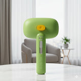 Happy Animalia green 3-in-1 steam pet grooming brush with yellow button and USB charging