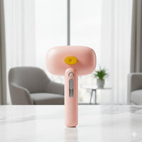 Happy Animalia pink 3-in-1 steam grooming brush for dogs and cats, with yellow button and grey slider.