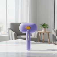 Happy Animalia purple 3-in-1 steam pet grooming brush with yellow button and grey slider. USB rechargeable.