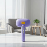 Happy Animalia purple 3-in-1 steam pet grooming brush with yellow button and grey slider. USB rechargeable.