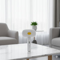 Happy Animalia white 3-in-1 steam pet grooming brush with yellow button and USB charging