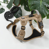 Happy Animalia tan nylon dog harness with integrated AirTag holder and reflective trim. Includes matching leash.