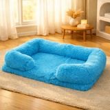 Panier orthopédique et apaisant bleu turquoise pour grand chien Happy Animalia, posé sur un tapis dans un salon chaleureux.